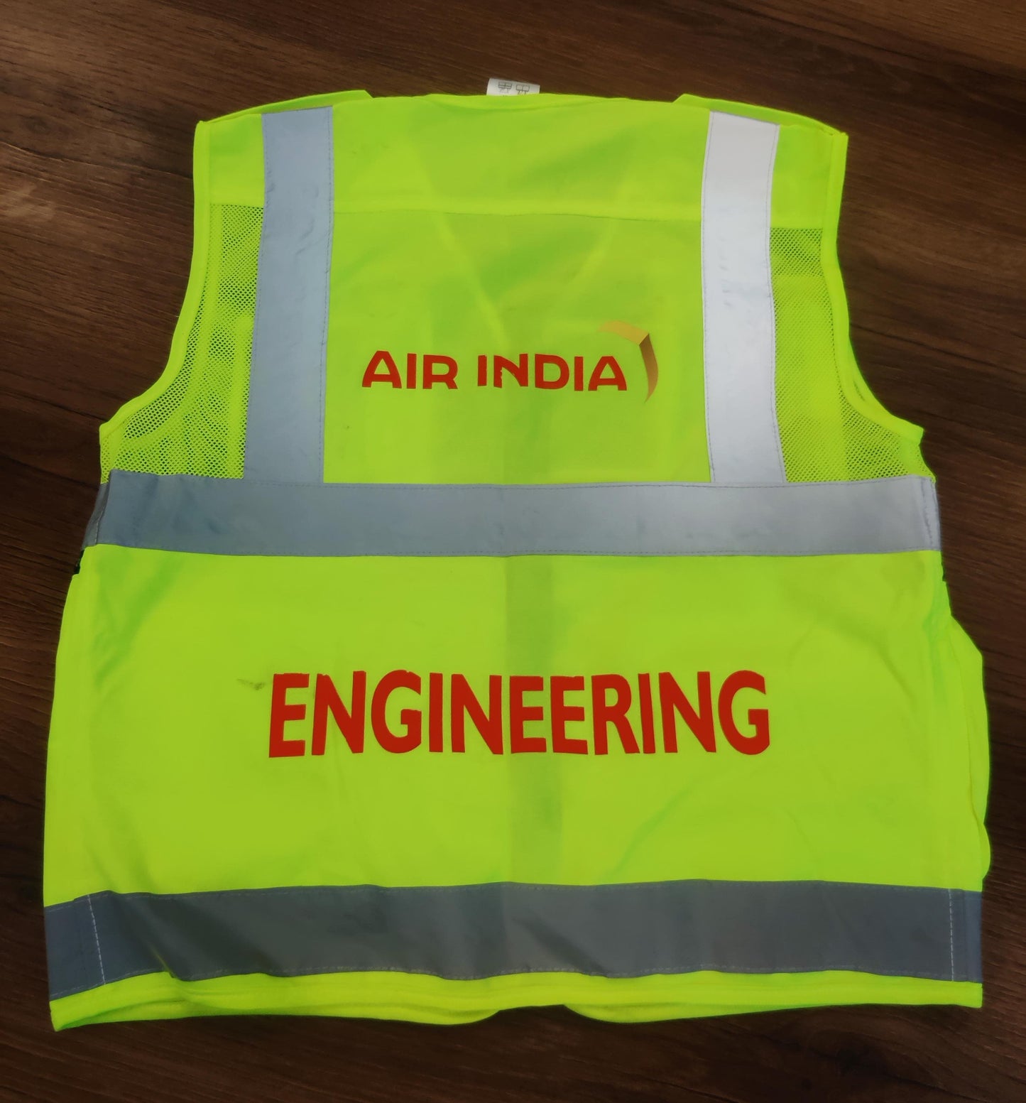Back view of Air India Engineering reflective vest with premium reflective strips