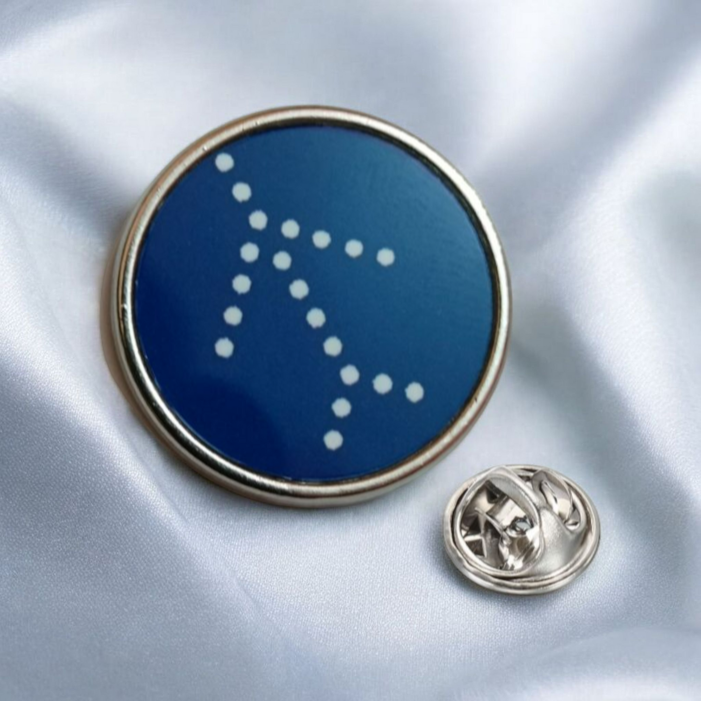 IndiGo Logo Circular Lapel Pin – Blue and Silver Aviation Badge by Global MitRa on Light Blue Fabric Background