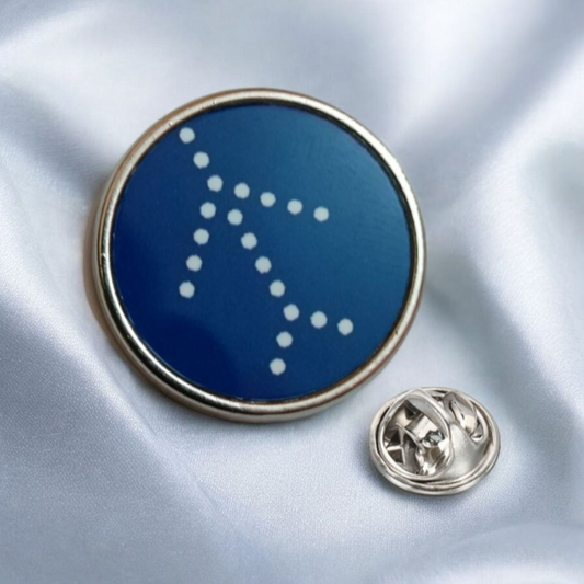 IndiGo Logo Circular Lapel Pin – Blue and Silver Aviation Badge by Global MitRa on Light Blue Fabric Background